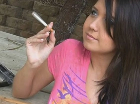 Holding a cigarette and teasing her friend